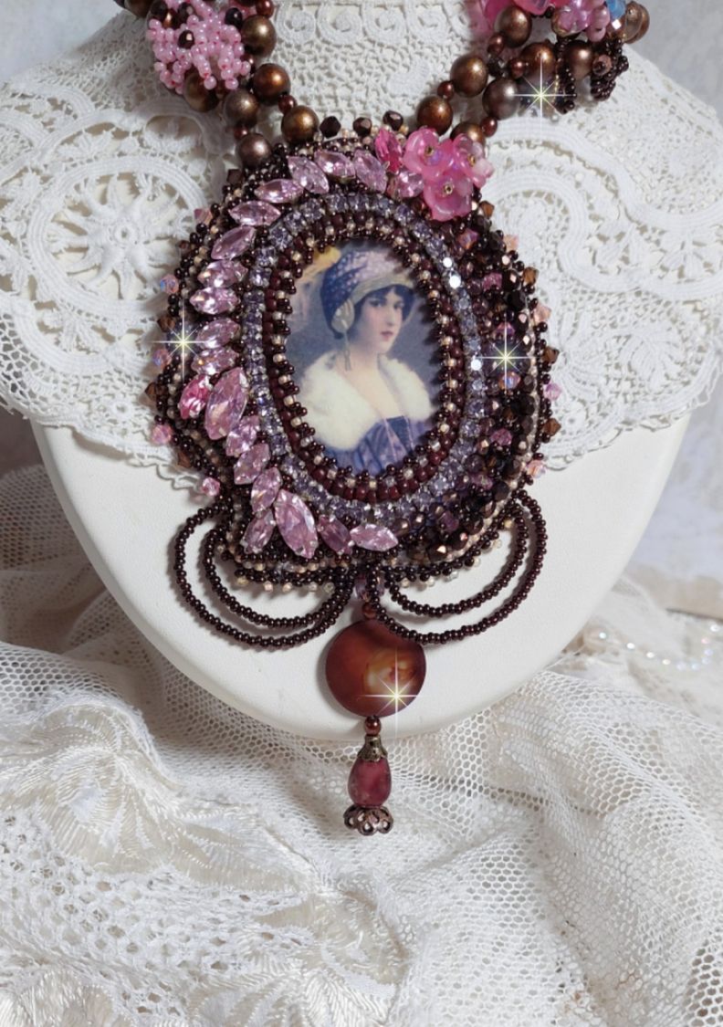 Belle Romance Haute-Couture necklace embroidered with a cabochon portrait of a woman in a hat with crystals, satin pearls, golden round pearls, mother of pearl cabochons and 