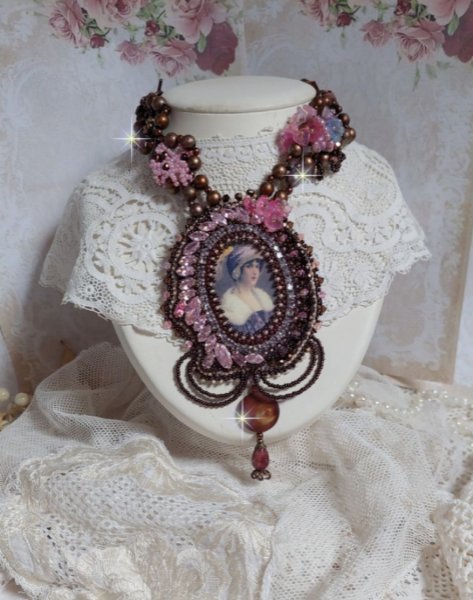 Belle Romance Haute-Couture necklace embroidered with a cabochon portrait of a woman in a hat with crystals, satin pearls, golden round pearls, mother of pearl cabochons and 
