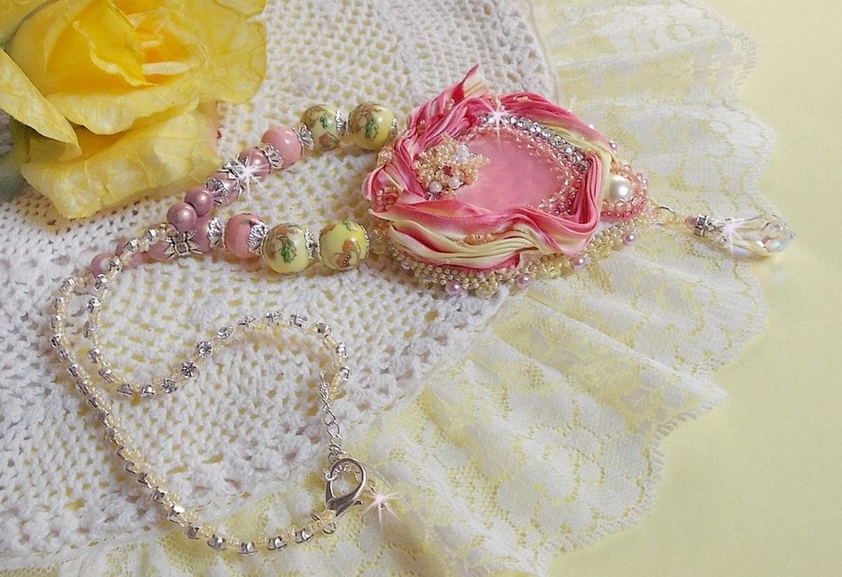 Tender Heart necklace embroidered with a pink and yellow silk ribbon, ceramic beads, Swarovski crystals and seed beads