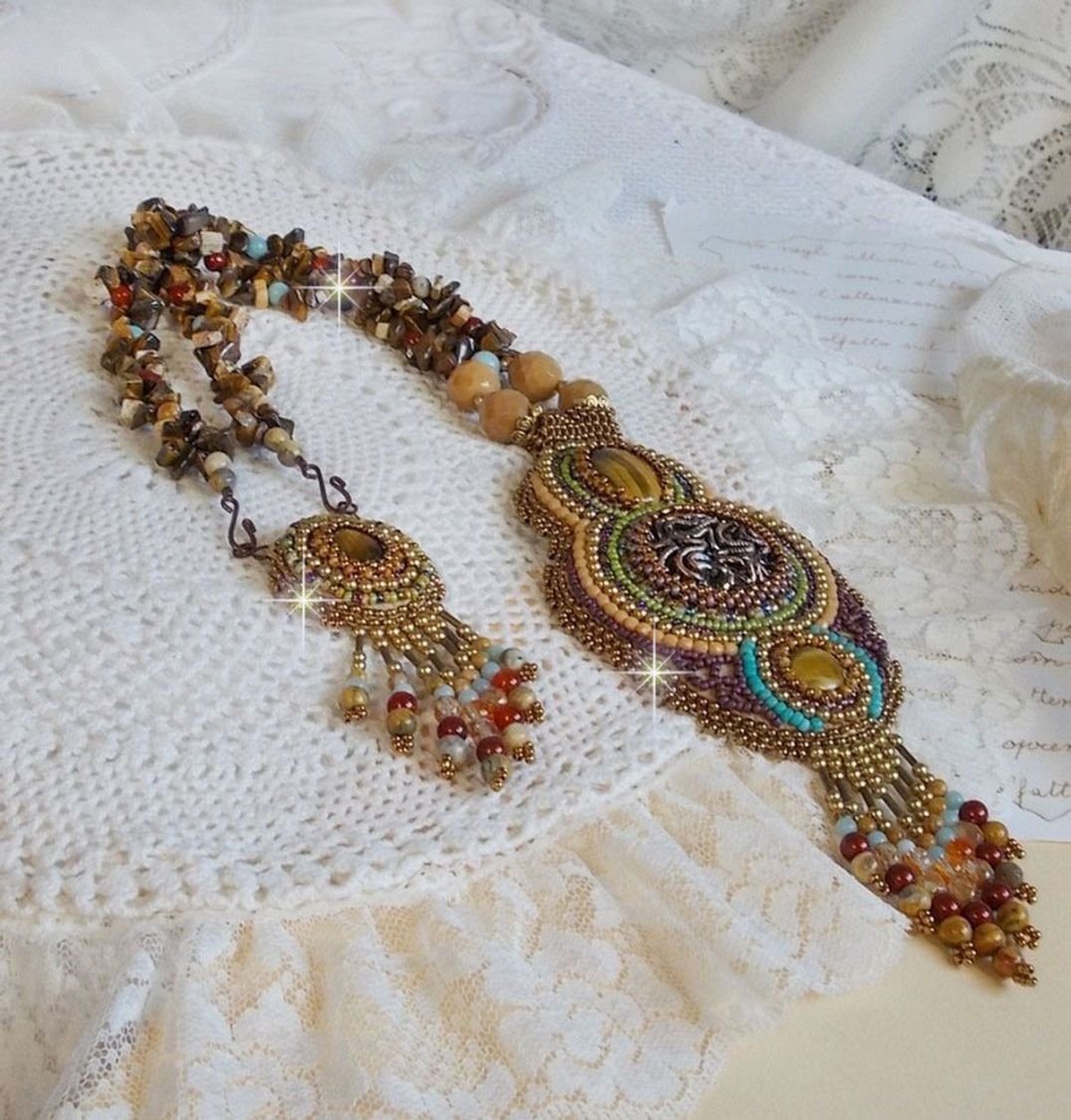 Fauve pendant necklace embroidered with several tiger eyes, Haute-Couture style