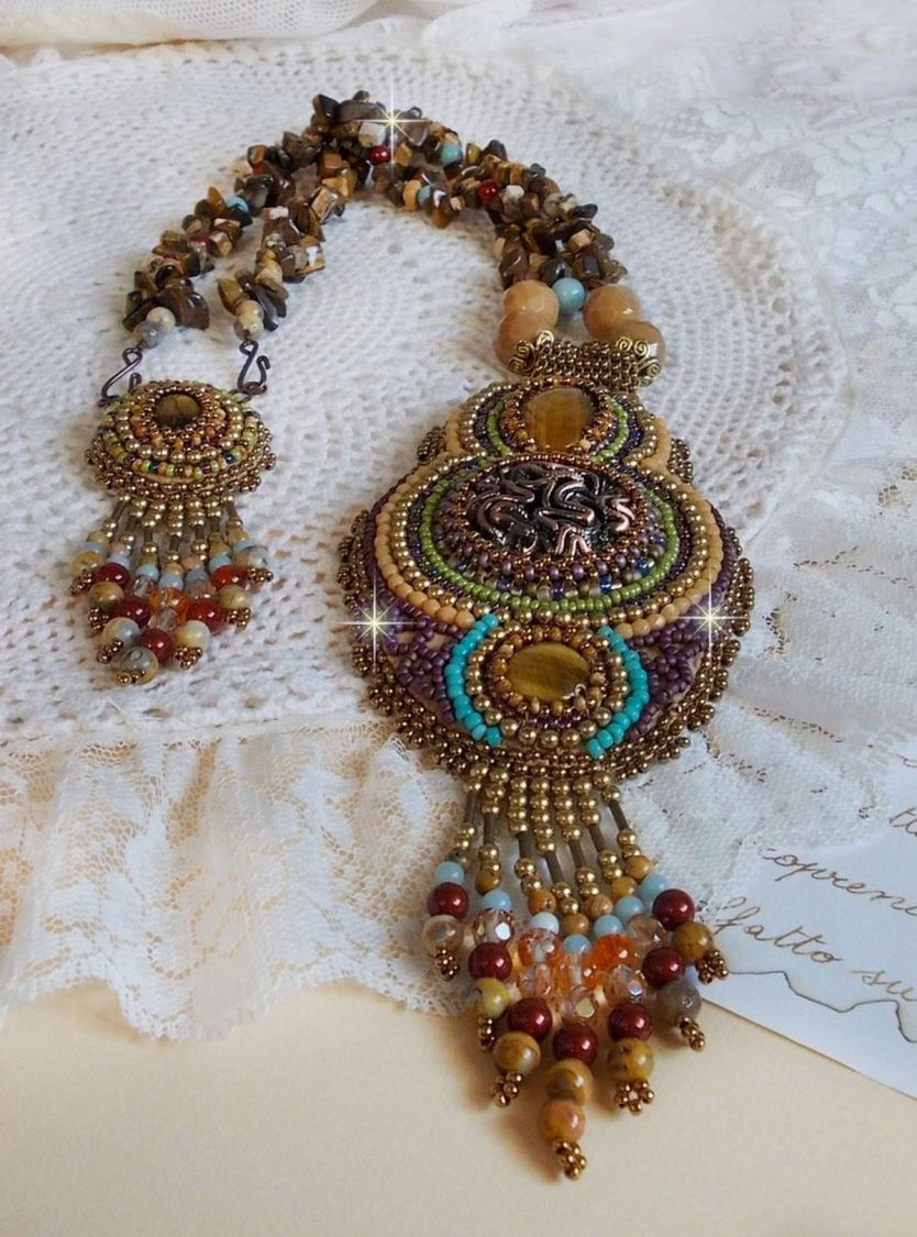 Fauve pendant necklace embroidered with several tiger eyes, Haute-Couture style