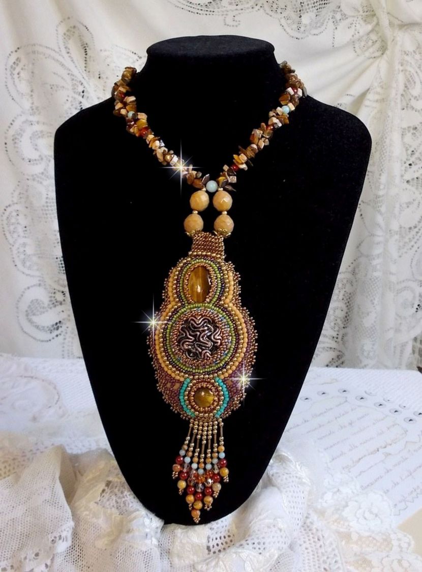 Fauve pendant necklace embroidered with several tiger eyes, Haute-Couture style