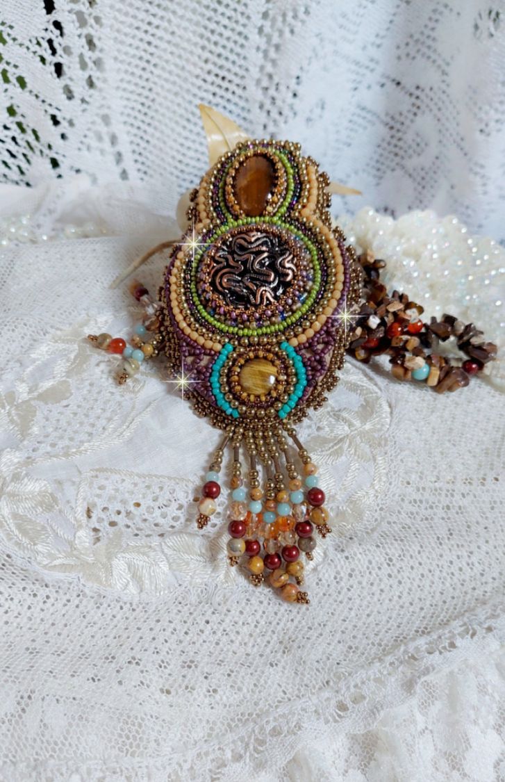 Fauve pendant necklace embroidered with several tiger eyes, Haute-Couture style