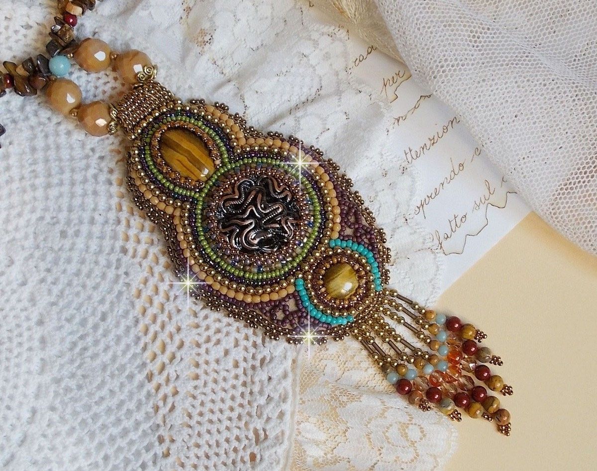 Fauve pendant necklace embroidered with several tiger eyes, Haute-Couture style