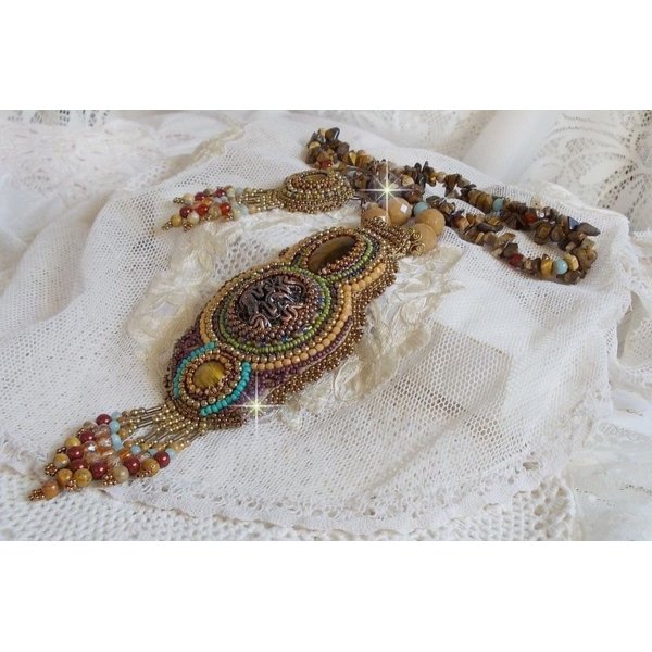 Fauve pendant necklace embroidered with several tiger eyes, Haute-Couture style