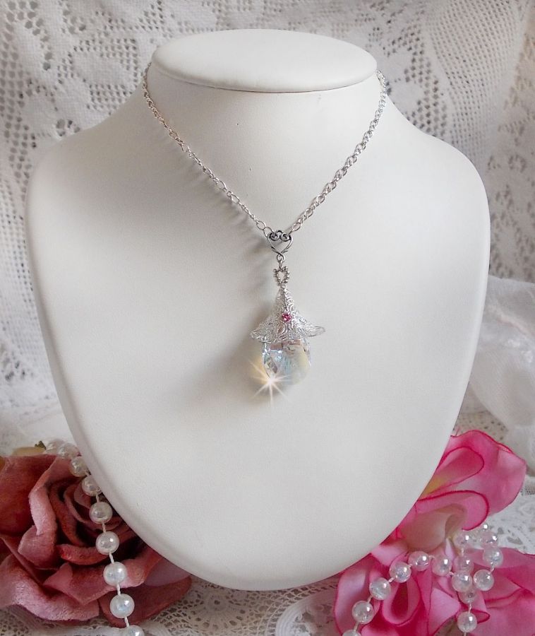 Silver Flower Necklace with a wonderful Swarovski crystal pendant, a silver heart insert with chain, rings, clasp and extension chain in Silver 925/1000