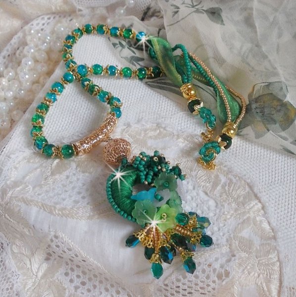 Green Iris necklace embroidered with emerald green DMC cotton, Swarovski crystals, resin beads and seed beads