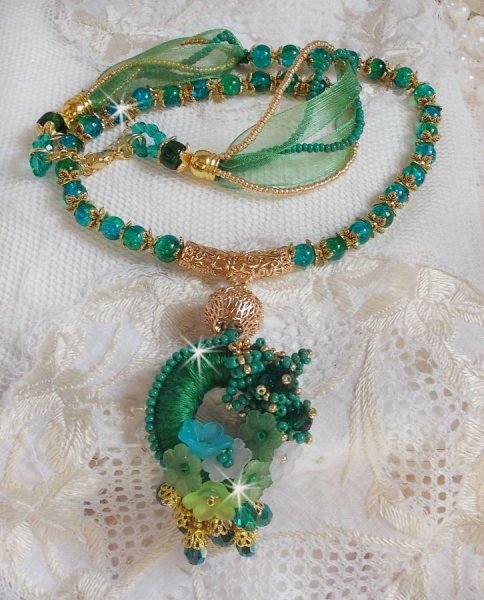 Green Iris necklace embroidered with emerald green DMC cotton, Swarovski crystals, resin beads and seed beads