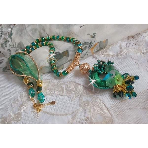 Green Iris necklace embroidered with emerald green DMC cotton, Swarovski crystals, resin beads and seed beads