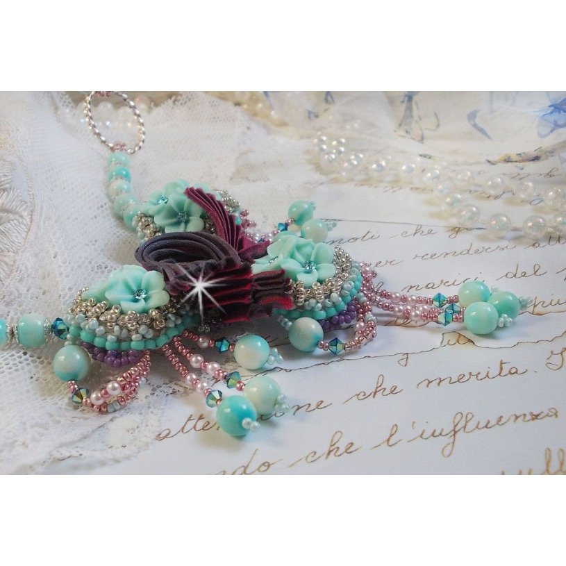 Blue Flowers Haute-Couture necklace embroidered with Swarovski crystals, a silk ribbon in Truffle/Raspberry color and seed beads