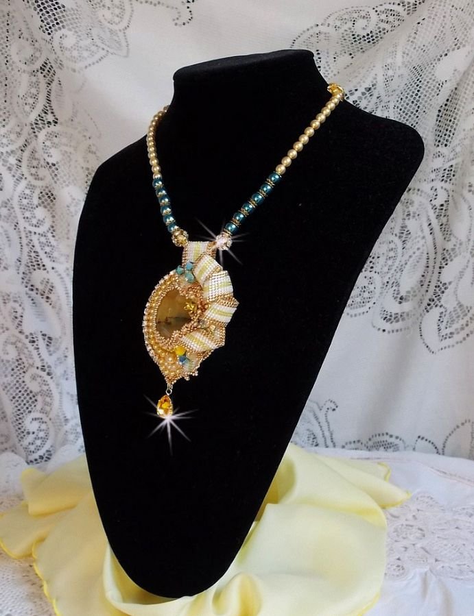 Haute-Couture Sunflower Gold pendant embroidered with 24 karat gold-plated seed beads, a Madagascar opal and Swarovski crystals.