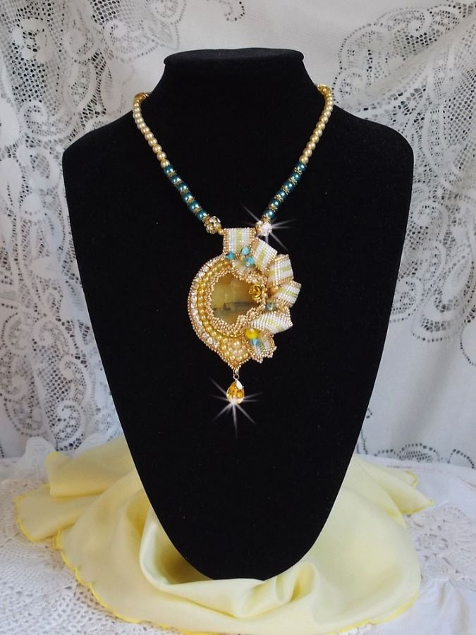 Haute-Couture Sunflower Gold pendant embroidered with 24 karat gold-plated seed beads, a Madagascar opal and Swarovski crystals.