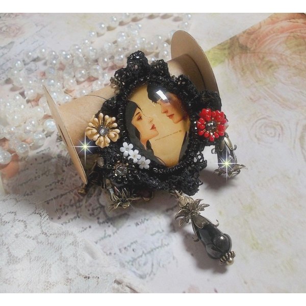 Love Romance necklace created with crystals, an oval cabochon representing two women, Quartz, Hematite, gold plated beads and other accessories