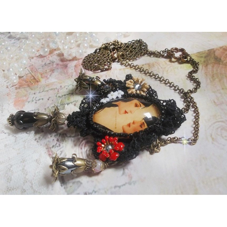 Love Romance necklace created with crystals, an oval cabochon representing two women, Quartz, Hematite, gold plated beads and other accessories