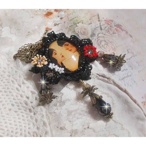 Love Romance necklace created with crystals, an oval cabochon representing two women, Quartz, Hematite, gold plated beads and other accessories