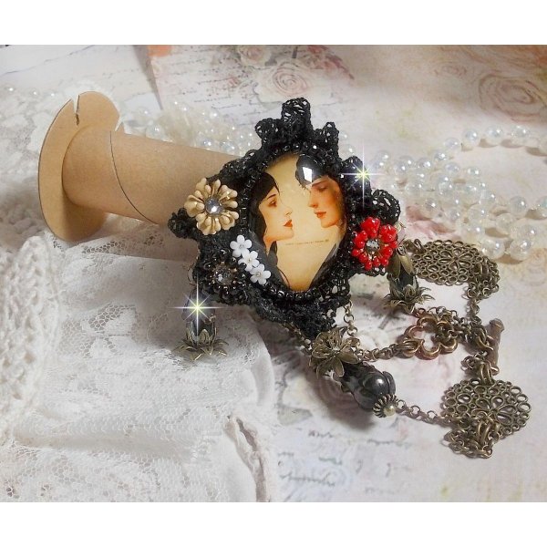 Love Romance necklace created with crystals, an oval cabochon representing two women, Quartz, Hematite, gold plated beads and other accessories