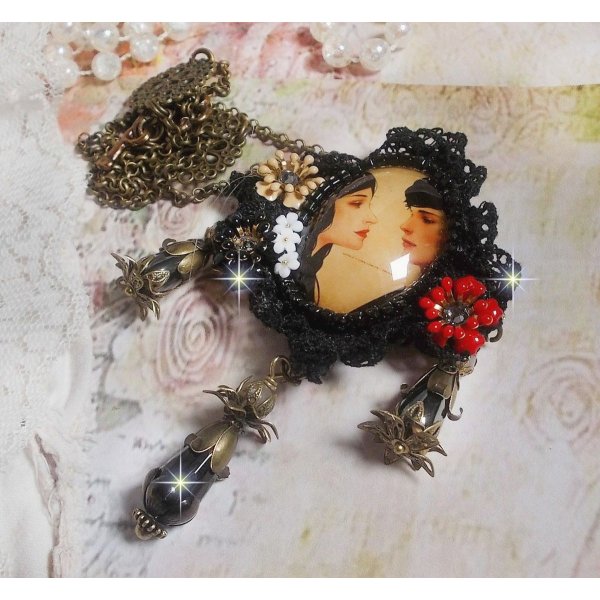 Love Romance necklace created with crystals, an oval cabochon representing two women, Quartz, Hematite, gold plated beads and other accessories