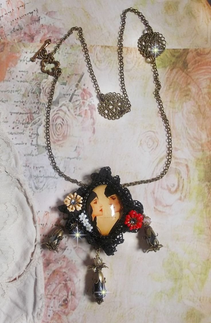 Love Romance necklace created with crystals, an oval cabochon representing two women, Quartz, Hematite, gold plated beads and other accessories