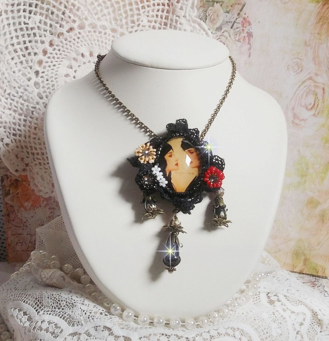 Love Romance necklace created with crystals, an oval cabochon representing two women, Quartz, Hematite, gold plated beads and other accessories