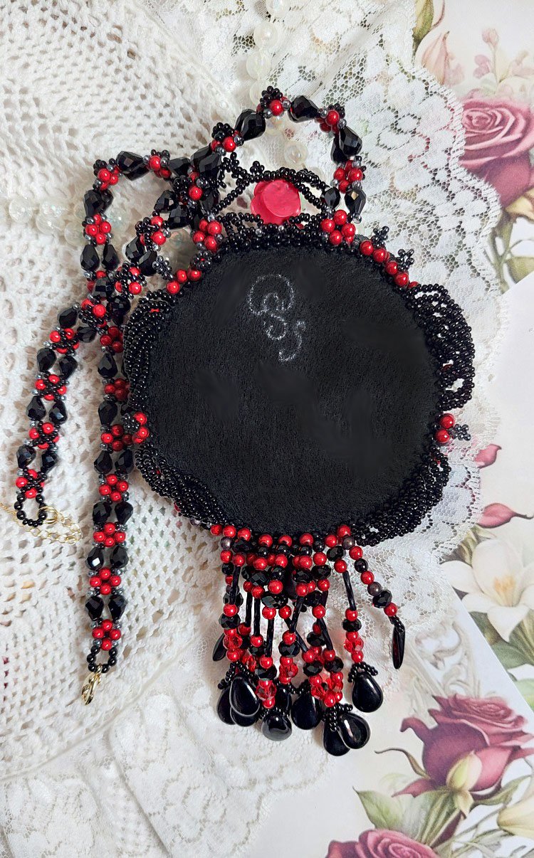 Midnight in Paris necklace embroidered with Swarovski crystals, resin roses, rocailles and black daggers