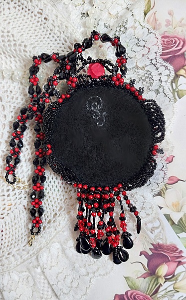 Midnight in Paris necklace embroidered with Swarovski crystals, resin roses, rocailles and black daggers