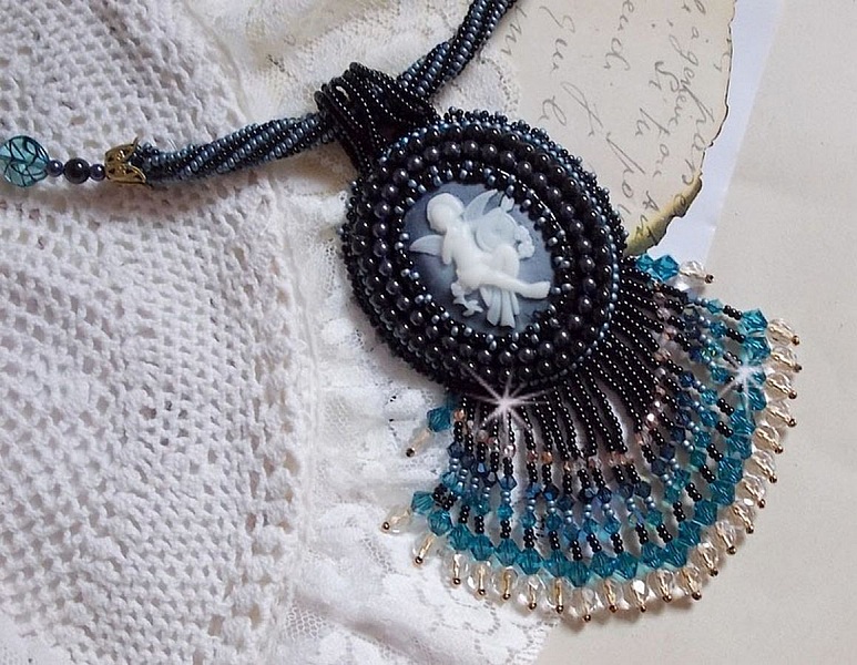 Angelot pendant necklace embroidered with an acrylic Angel, Swarovski crystal spinning tops and Japanese seed beads