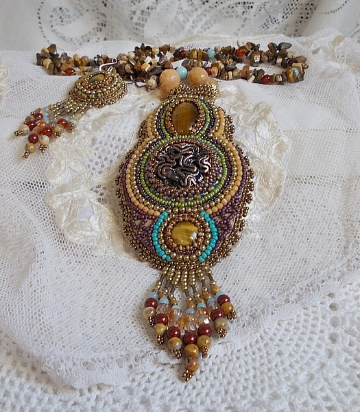 Fauve pendant necklace embroidered with several tiger eyes, Haute-Couture style