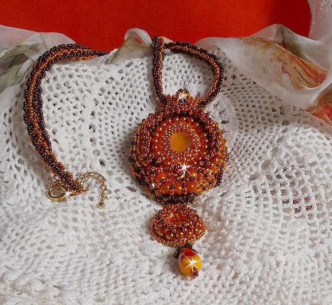Lady in Orange pendant necklace is embroidered with Swarovski crystals, Miyuki seed beads and magic beads.