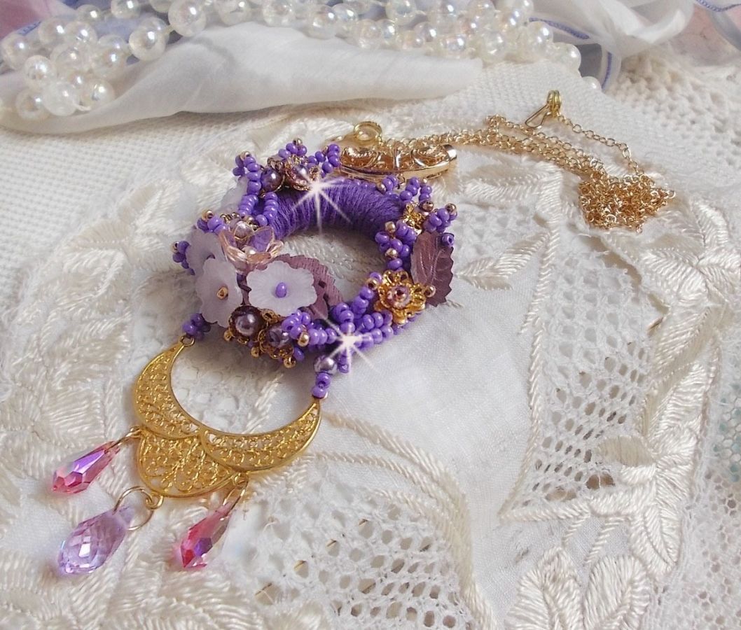 Laureline pendant necklace embroidered with purple DMC cotton, Swarovski crystals and frosted flowers.