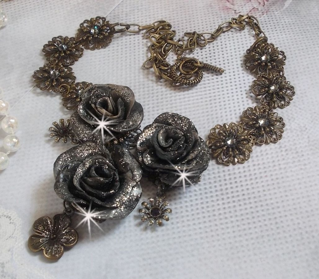 Steampunk Queen necklace created with black and brown porcelain roses, crystal cabochons and bronze accessories