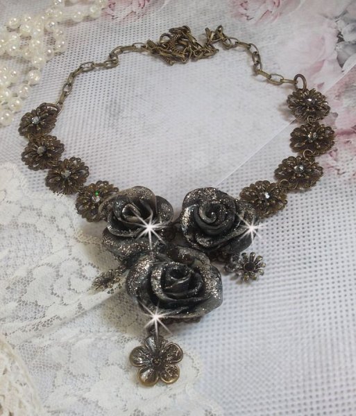Steampunk Queen necklace created with black and brown porcelain roses, crystal cabochons and bronze accessories