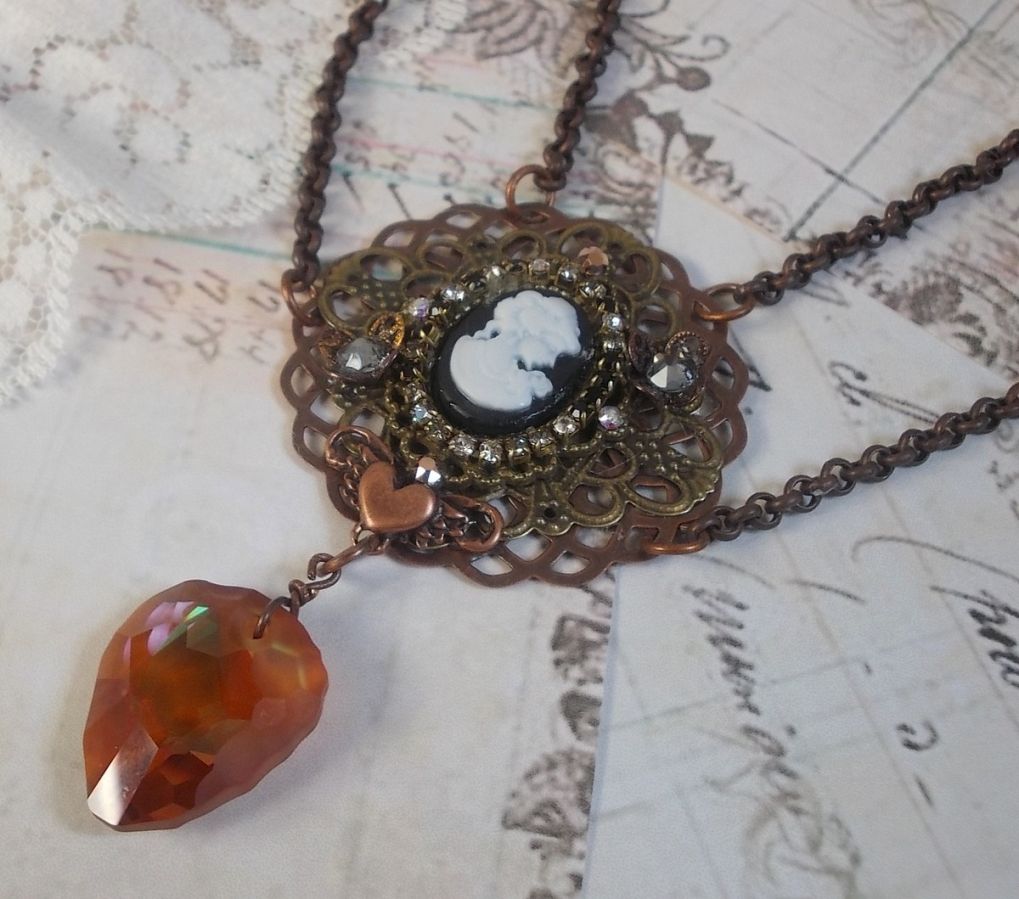 Watson necklace created with prints, a Swarovski crystal pendant with retro look, brass accessories and a resin cabochon