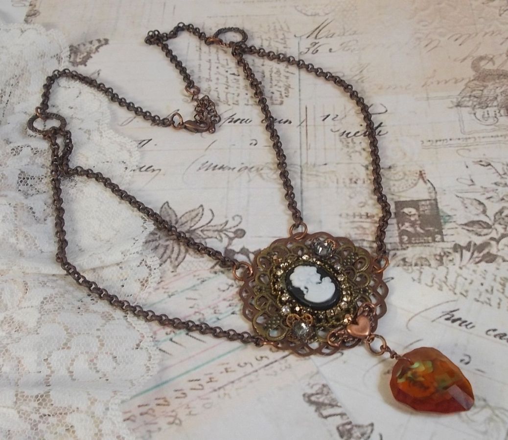 Watson necklace created with prints, a Swarovski crystal pendant with retro look, brass accessories and a resin cabochon