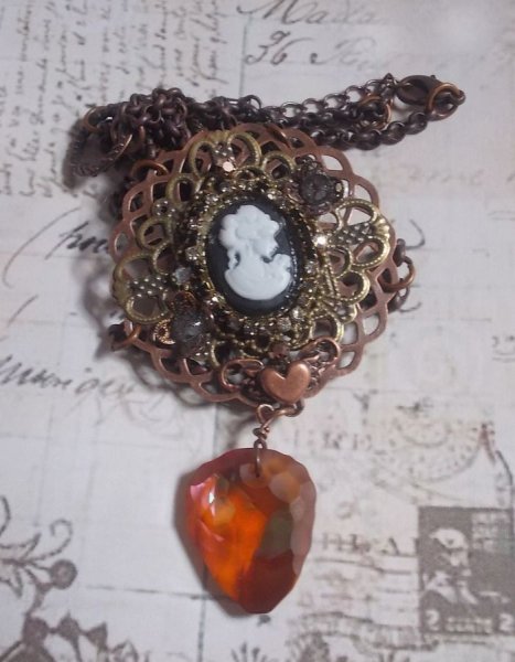 Watson necklace created with prints, a Swarovski crystal pendant with retro look, brass accessories and a resin cabochon