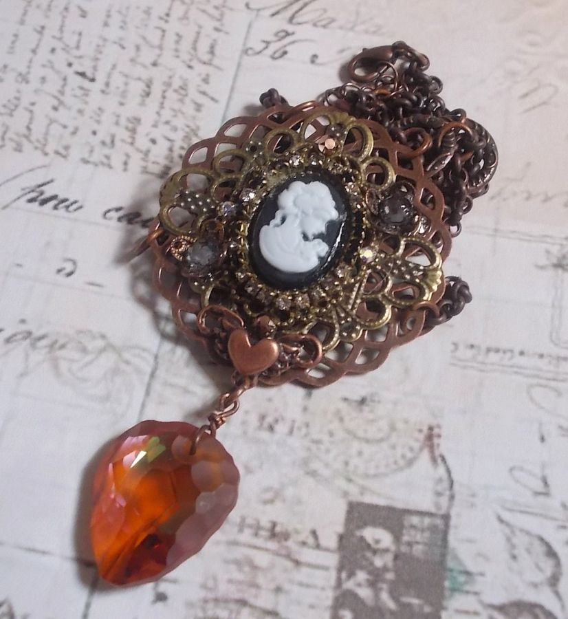 Watson necklace created with prints, a Swarovski crystal pendant with retro look, brass accessories and a resin cabochon