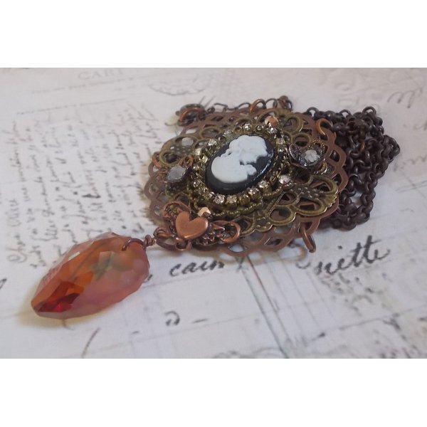 Watson necklace created with prints, a Swarovski crystal pendant with retro look, brass accessories and a resin cabochon