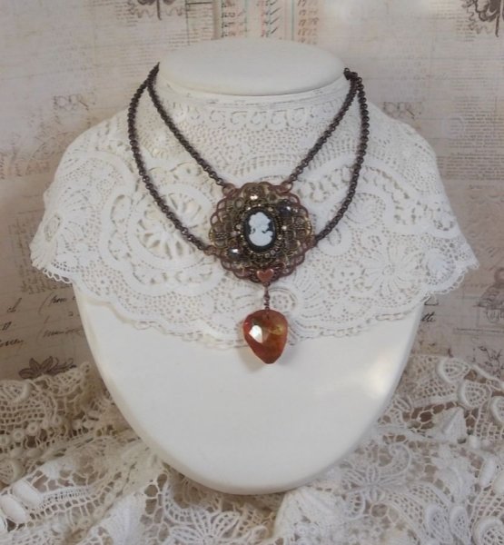 Watson necklace created with prints, a Swarovski crystal pendant with retro look, brass accessories and a resin cabochon