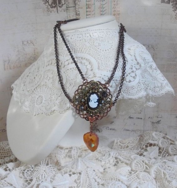 Watson necklace created with prints, a Swarovski crystal pendant with retro look, brass accessories and a resin cabochon