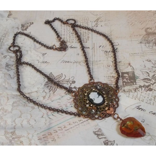Watson necklace created with prints, a Swarovski crystal pendant with retro look, brass accessories and a resin cabochon