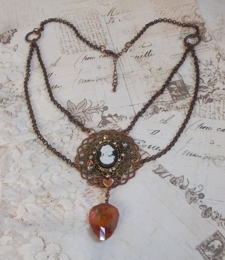 Watson necklace created with prints, a Swarovski crystal pendant with retro look, brass accessories and a resin cabochon