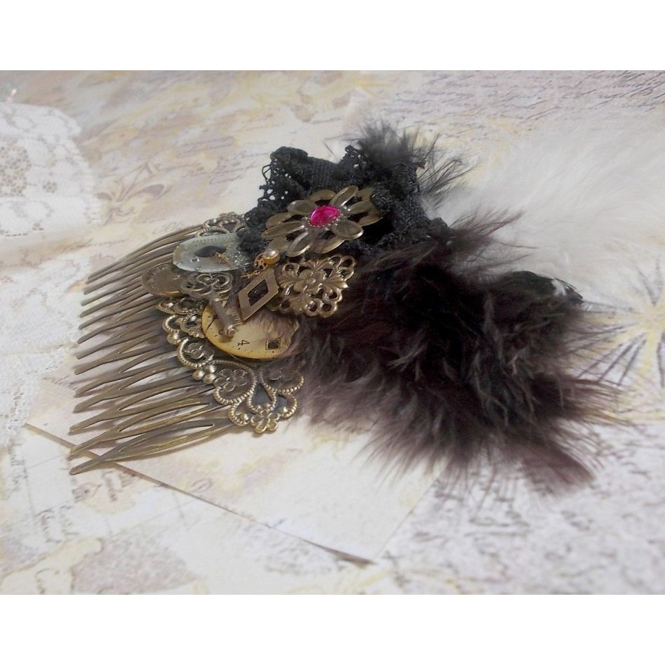 Curiosity Time hair comb created with black lace, various accessories, charms of gold, silver, bronze colors with black, brown and white feathers