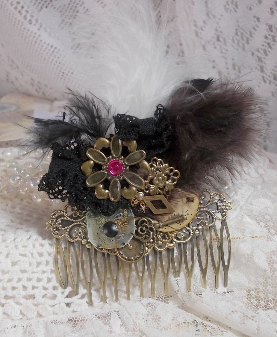 Curiosity Time hair comb created with black lace, various accessories, charms of gold, silver, bronze colors with black, brown and white feathers