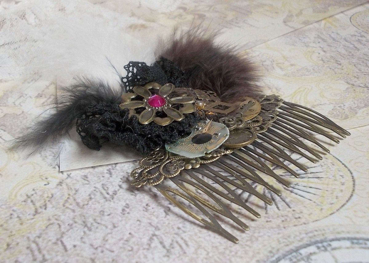 Curiosity Time hair comb created with black lace, various accessories, charms of gold, silver, bronze colors with black, brown and white feathers