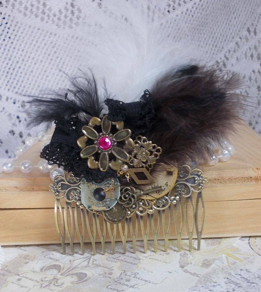 Curiosity Time hair comb created with black lace, various accessories, charms of gold, silver, bronze colors with black, brown and white feathers