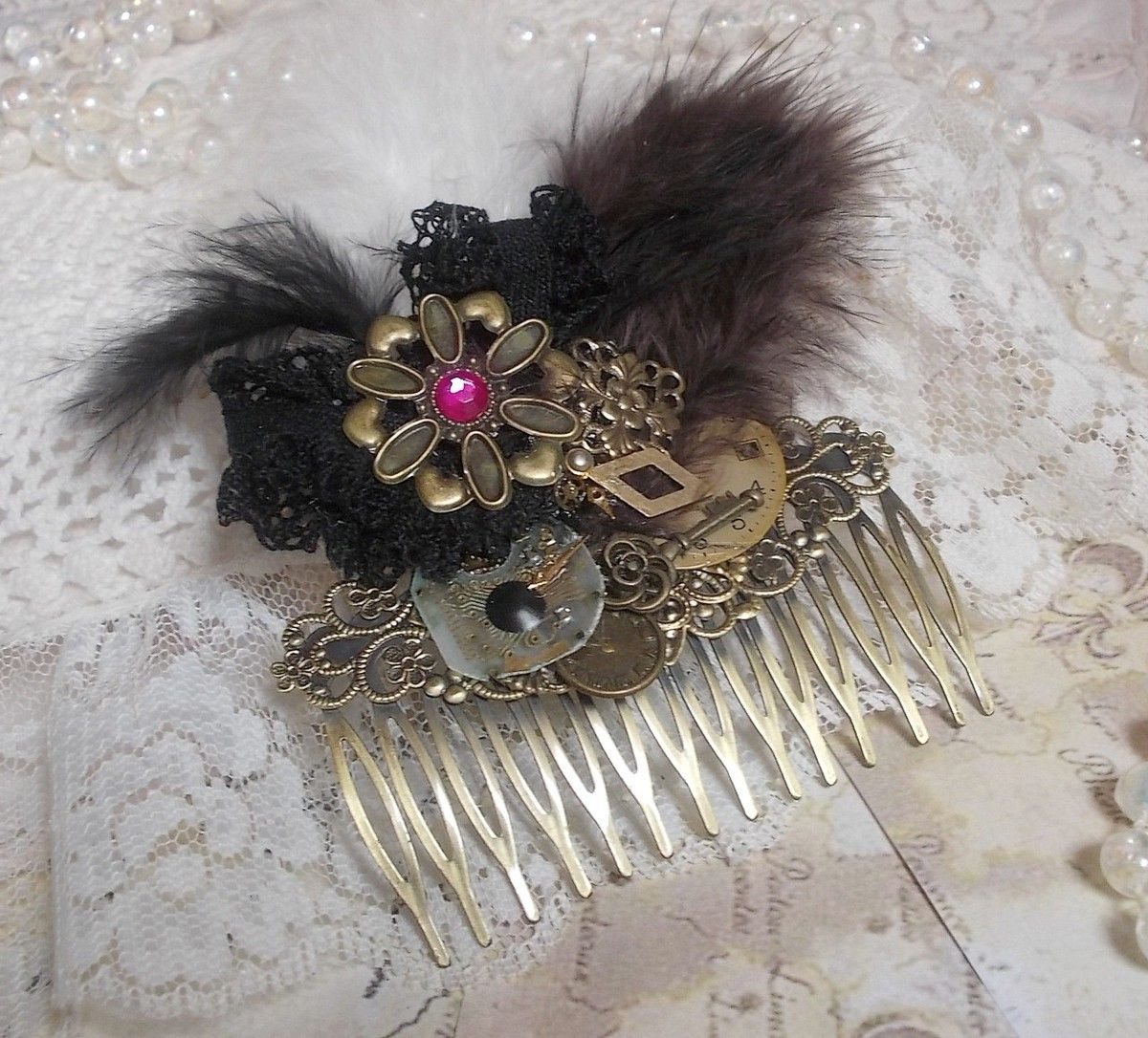 Curiosity Time hair comb created with black lace, various accessories, charms of gold, silver, bronze colors with black, brown and white feathers