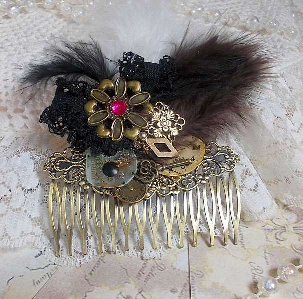Curiosity Time hair comb created with black lace, various accessories, charms of gold, silver, bronze colors with black, brown and white feathers