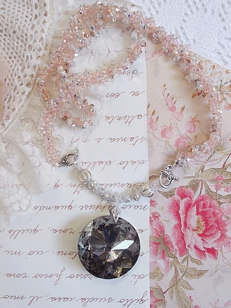 Coco pendant necklace embroidered with Swarovski crystals and a smoked crystal medallion