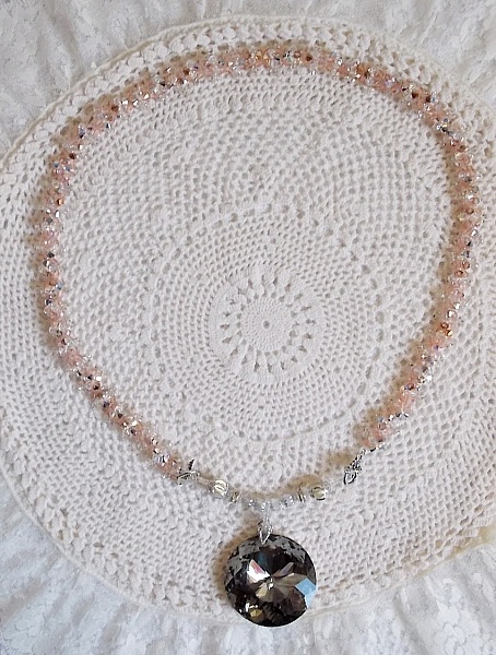 Coco pendant necklace embroidered with Swarovski crystals and a smoked crystal medallion