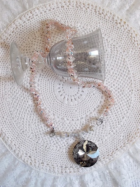Coco pendant necklace embroidered with Swarovski crystals and a smoked crystal medallion