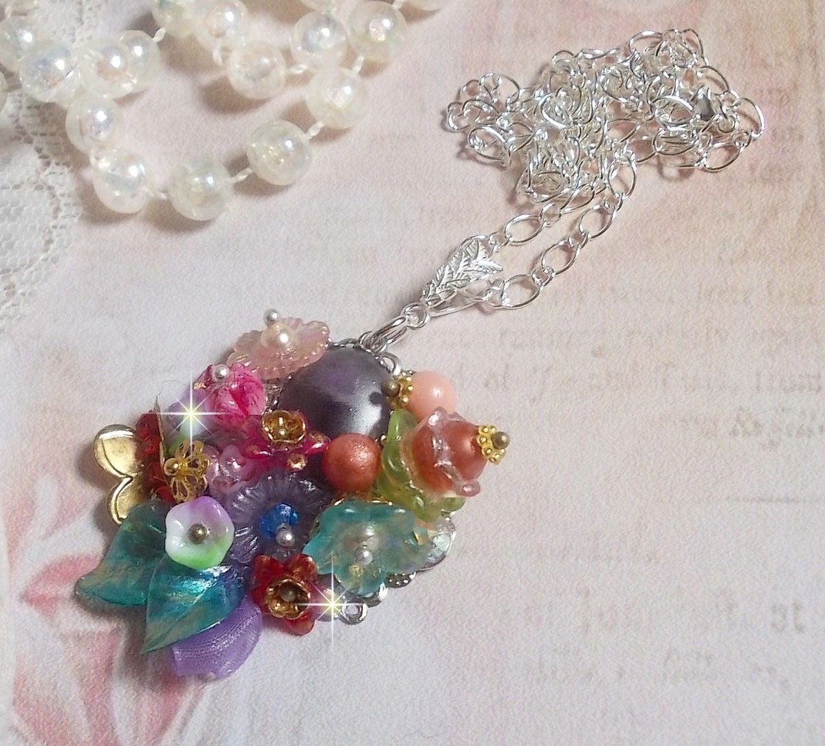 Springtime Chic Crown Pendant created with various flowers, pearls, Murano, crystals, Amethyst and others with a Silver chain